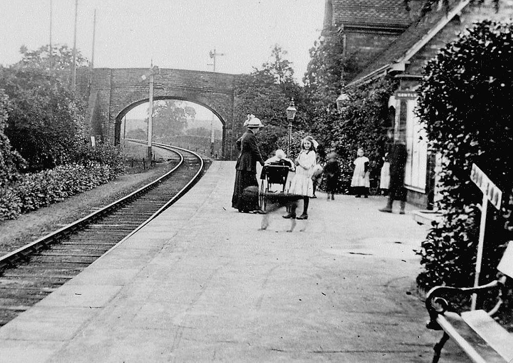 Passengers wait on the platform as a train from Redditch is given  the all clear to proceed to Evesham