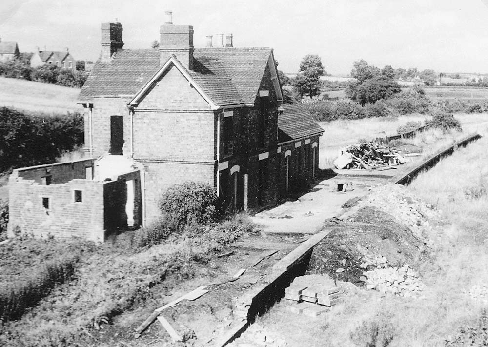 View showing the abandoned station building sometime after closure of the line with some demolition evident