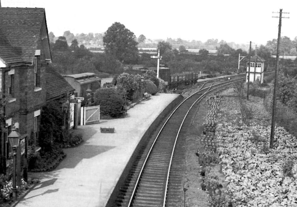 Close up showing the goods yard, its traffic and the passing loop in greater detail