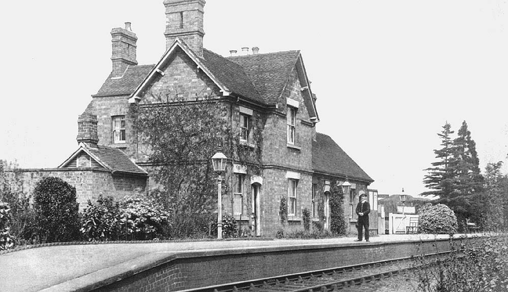 View of the station's booking office and passenger facilities on the right and the substantial private dwelling