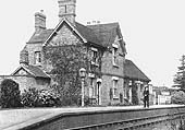 View of the station's booking office and passenger facilities on the right and the substantial private dwelling