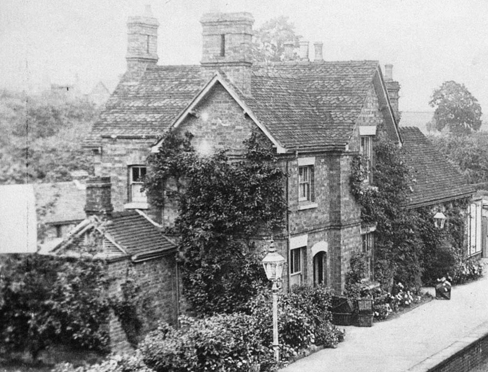 Close up showing the station master's house and single-storey booking office and waiting rooms