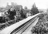 An Edwardian elevated view of Harvington station showing the abundance of decorative flowerbeds and ivy