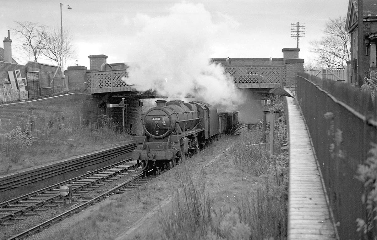 Ex-LMS 5MT 4-6-0 No 44812 passes beneath Cartland Road bridge at the site of the former station with a class F service