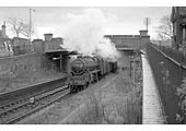 Ex-LMS 5MT 4-6-0 No 44812 passes beneath Cartland Road bridge at the site of the former station with a class F service