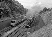 Ex-LMS 2-6-0 'Hughes Crab' No 42763 is working hard as it climbs past Hazelwell goods yard on 20th July 1957