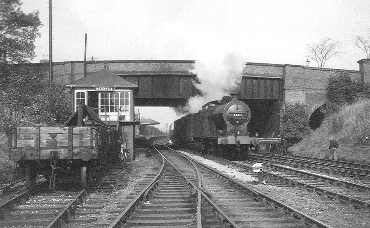 Ex-LMS 0-6-0 4F No 44411 passes Hazelwell signal box at the head of a Class E 'Maltese' express freight service
