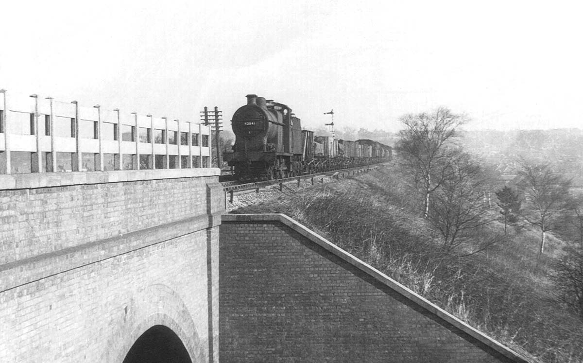 Ex-LMS 0-6-0 4F No 43941 is seen hauling a Class K stopping freight as it is about to cross the Worcester & Birmingham canal on 4th March 1956