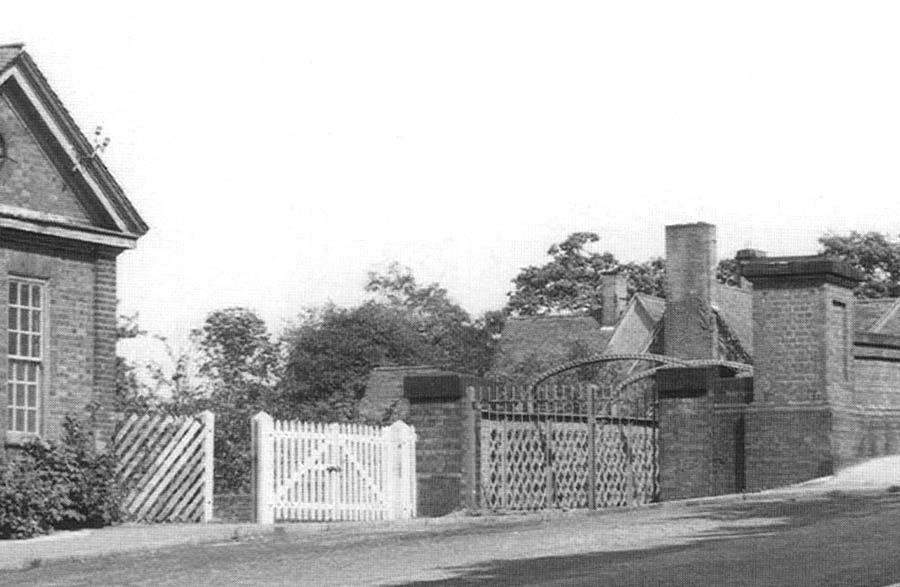 Close up the exterior Hazelwell showing the entrance to the up platform and the footbridge which ran alongside the road bridge
