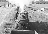 Ex LMS 4-6-0 'Stanier Black Five' No 44828 is seen propelling a rake of wagons towards Baddesley Colliery