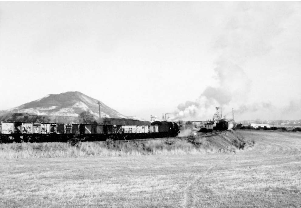 Ex-LMS 4-6-0 5MT No 44828 is seen entering Hall End Colliery with a train of empty steel bodied mineral wagons