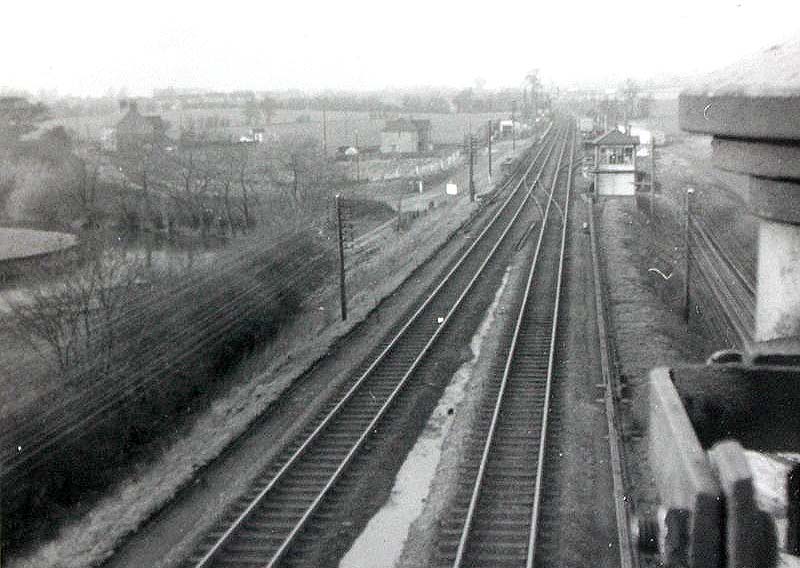 Looking north from the Junction's down signal gantry towards Kingsbury Station Junction signal box and the station beyond