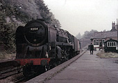 British Railways Standard Class 9F No 92154 passes through Kings Heath with a single guards van in tow
