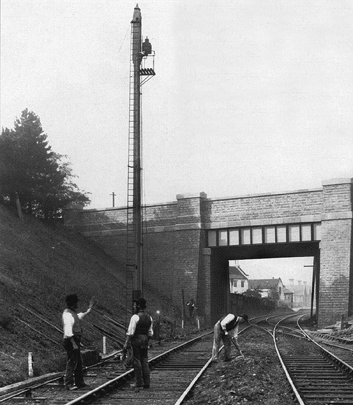 Looking south towards Gloucester in 1886 showing the replacement Queen's bridge and the station through the arch