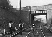 Looking south towards Gloucester showing the replacement bridge and the station through the arch