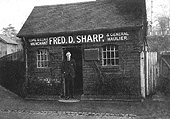 Now under new ownership, Leslie Williams poses in the doorway of Fred D Sharp, Coal Merchant & General Haulier
