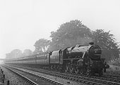LMS Stanier "Black 5" No 5280 sports reporting number 230 on an express