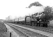 LMS 4-4-0 "Compound" No 1027 on a twelve coach express train