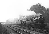 Ex-MR 4-4-0 2P No 406 pilots LMS 4-6-0 Jubilee class No 5638 Zanzibar on a 12 coach train