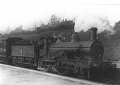 Ex-MR outside framed 2-4-0 No 1 is seen on a local passenger train to New Street
