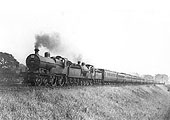 Ex-MR 2P 4-4-0 No 509 doubleheads ex-MR 2P 4-4-0 No 369 on a holiday special