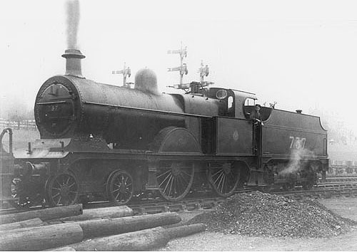 Ex-MR 3P 4-4-0 No 737 stands in the in sidings buffered up to another locomotive