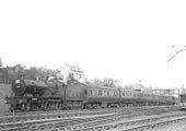 Ex-MR 4-4-0 'Compound' No 1001 heads a down express pasenger service past the carriage sidings in March 1930