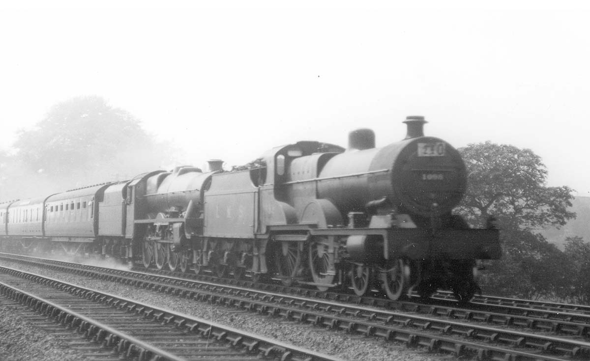 LMS 4-4-0 'Compound' 4P No 1098 pilots LMS 4-6-0 5XP Jubilee No 5659 'Drake' on a twelve coach train in 1937