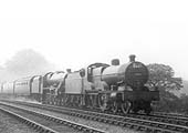 LMS 4-4-0 'Compound' 4P No 1098 pilots LMS 4-6-0 5XP Jubilee No 5659 'Drake' on a twelve coach train in 1937
