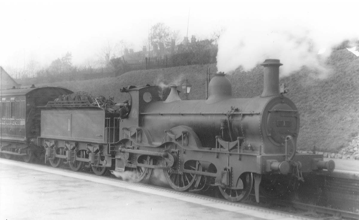 Ex-MR outside framed 2-4-0 No 1 is seen on a local passenger train to Birmingham New Street