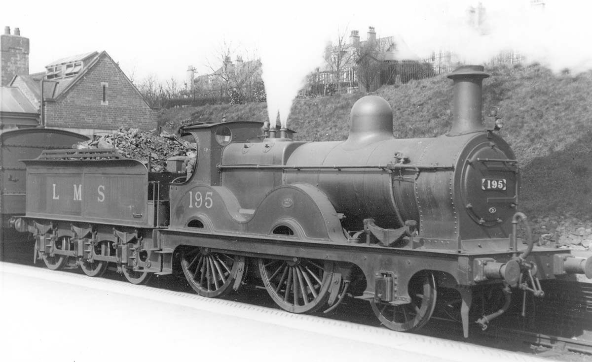 Ex-LMS 2-4-0 outside framed No 195 blows off as it readies to depart to Evesham on a local passenger working