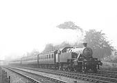 LMS Stanier 2-6-2T 3P No 92 is seen travelling at speed on a seven coach local passenger service in 1937