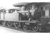 Ex-LTSR 2P 4-4-2T 'Tilbury Tank' No 2098 'Crouch Hill' stands at the head of a Redditch local passenger train on 11th April 1935
