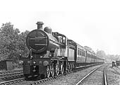 MR 4-4-0 2P No 518 is seen at the head of an express service near Kings Norton station on 9th July 1921