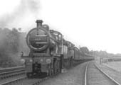 MR 4-4-0 No 524 doubleheads class mate MR 4-4-0 No 521 on a down express train as it passes the carriage sidings