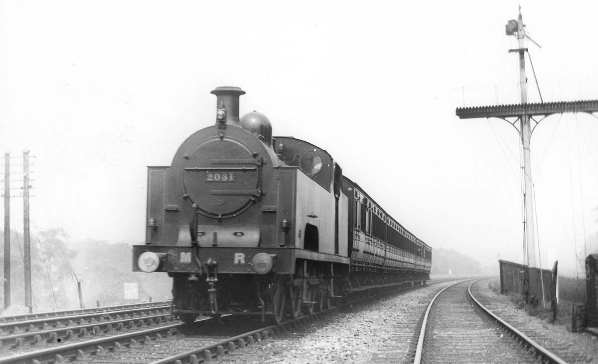 MR 0-6-4T "Flatiron" No 2031 on a stopping train as it passes some unusual MR signals