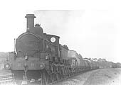 MR 0-6-0 No 2338 is seen coasting along whilst at the head of a mixed goods train comprising open wagons