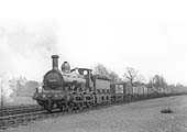 MR Kirtley outside-framed 0-6-0 No 2678 at the head of a long train of assorted open wagons passing the carriage sidings