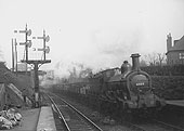 MR 0-6-0 No 2825 is seen at the head of a long down train of coal wagons as it enters Kings Norton station