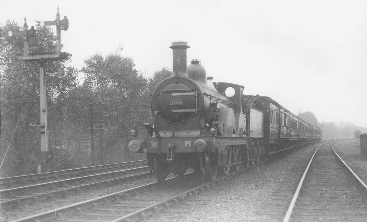 MR 2-4-0 No 206, a Bournville engine, is seen at the head of a local passenger train south of Kings Norton station during September 1921