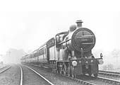 MR 4-4-0 No 329 passes at speed on an up express passenger train south of Kings Norton