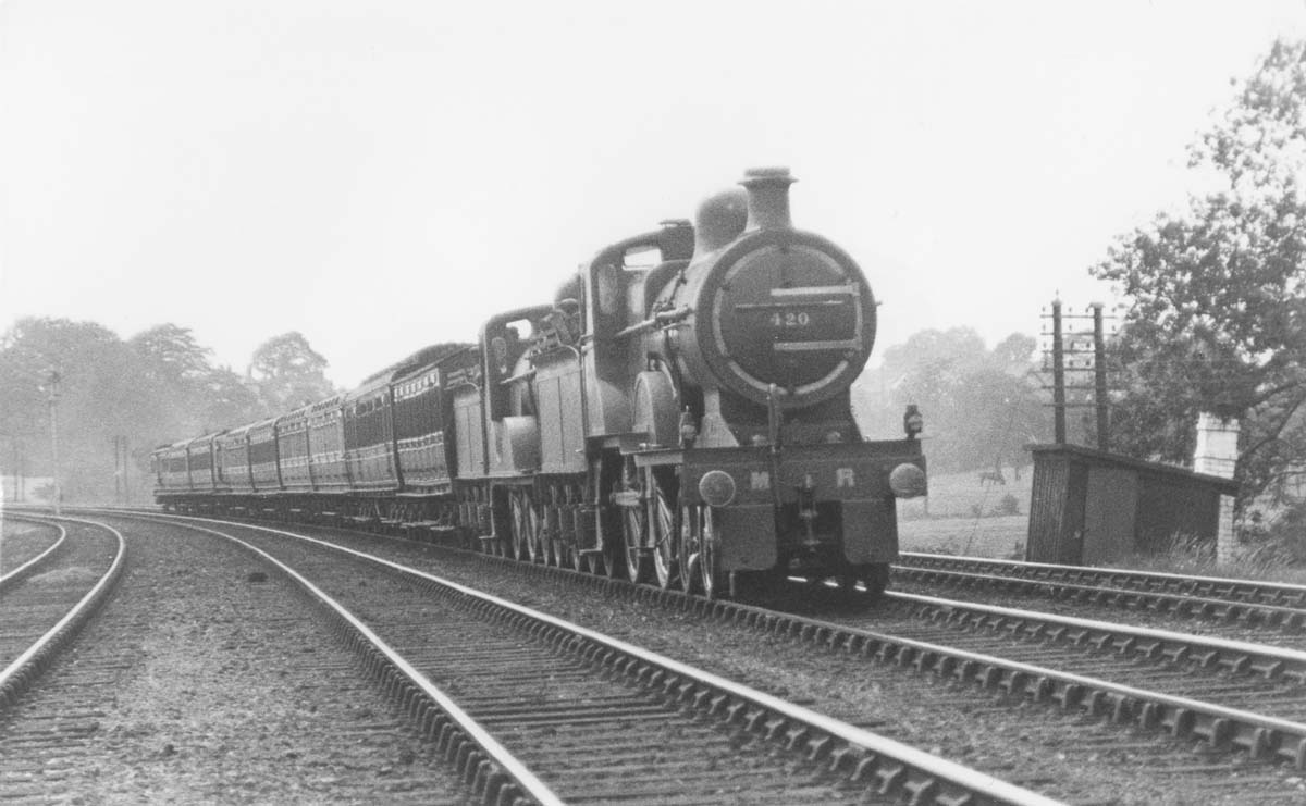 MR 4-4-0 No 420 double heads MR 4-4-0 No 438 on an express train south of Kings Norton station