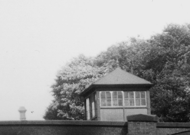 Close up showing King Norton's elevated signal box adjacent to Pershore Road which controlled access to the station