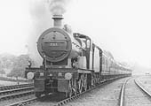 MR 4-4-0 No 723 at the head of an express train passing the carriage sidings