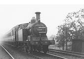 MR 0-4-4T No 1386 heads a local train from Redditch