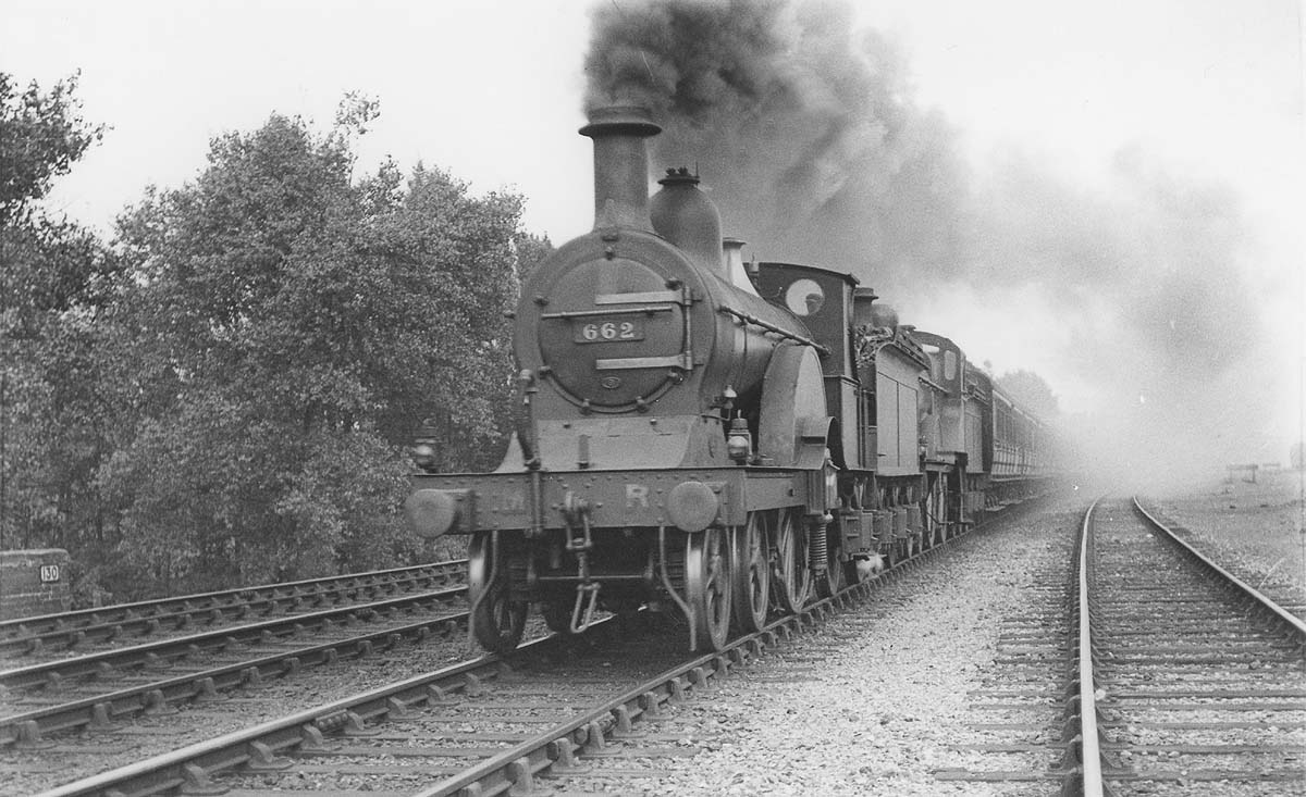 MR 'Single' 4-2-2 1P No 662, allocated to Saltley shed, is piloting MR 4-4-0 No 520 on a down express during August 1921