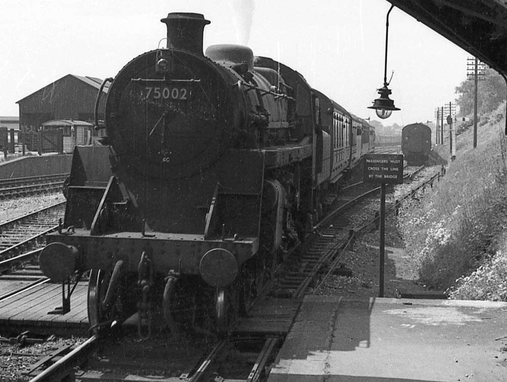 British Railways Standard Class 4MT 4-6-0 No 75002 runs into Kings Norton station at the head of Class B service