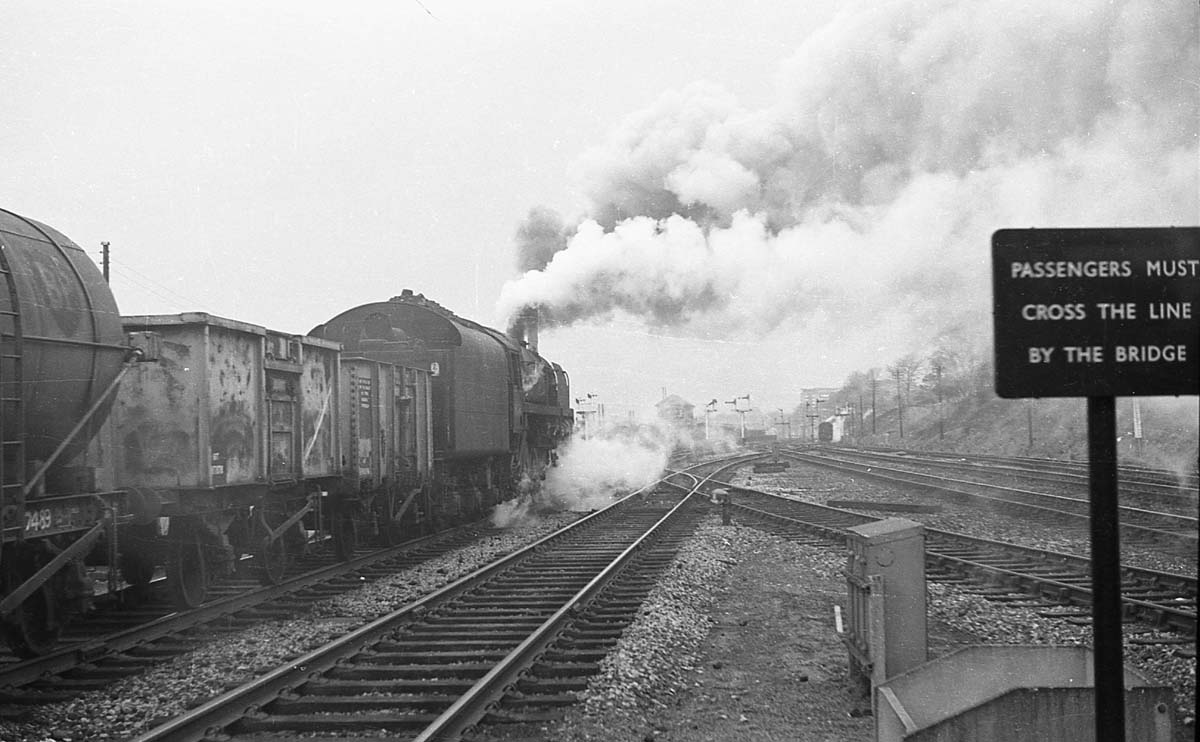 Ex-LMS 4F 0-6-0 No 44571 runs through Kings Norton Station with a Brake Van in tow on the way to the goods yard to pick up a goods working