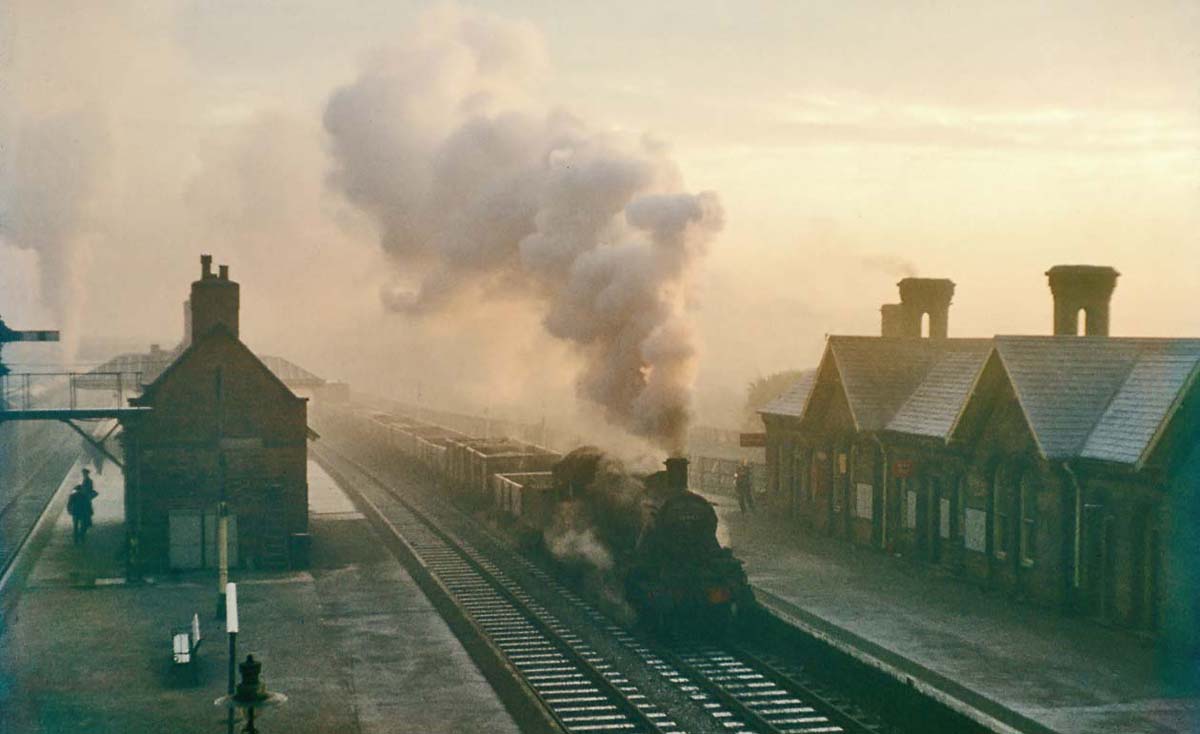 British Railways built 2MT 2-6-0 No 46442 is seen passing through Kings Norton on a down goods service on a cold misty frosty winter's morning