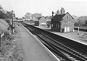 An elevated view of the enlarged station's West Suburban platforms showing the substantive buildings